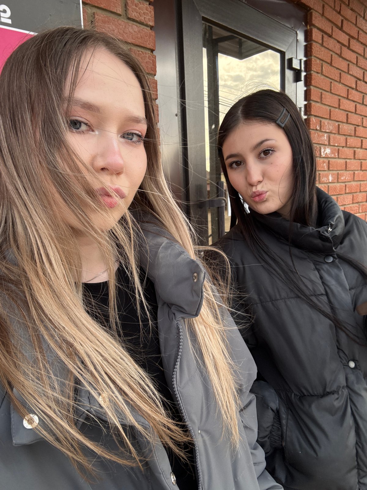Two women pose for casual photo in Фоки, Russia