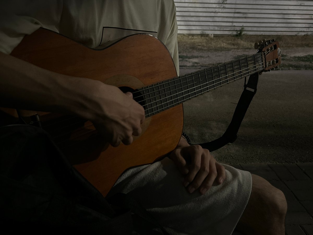 Guitar playing and evening strolls in a Taraz park