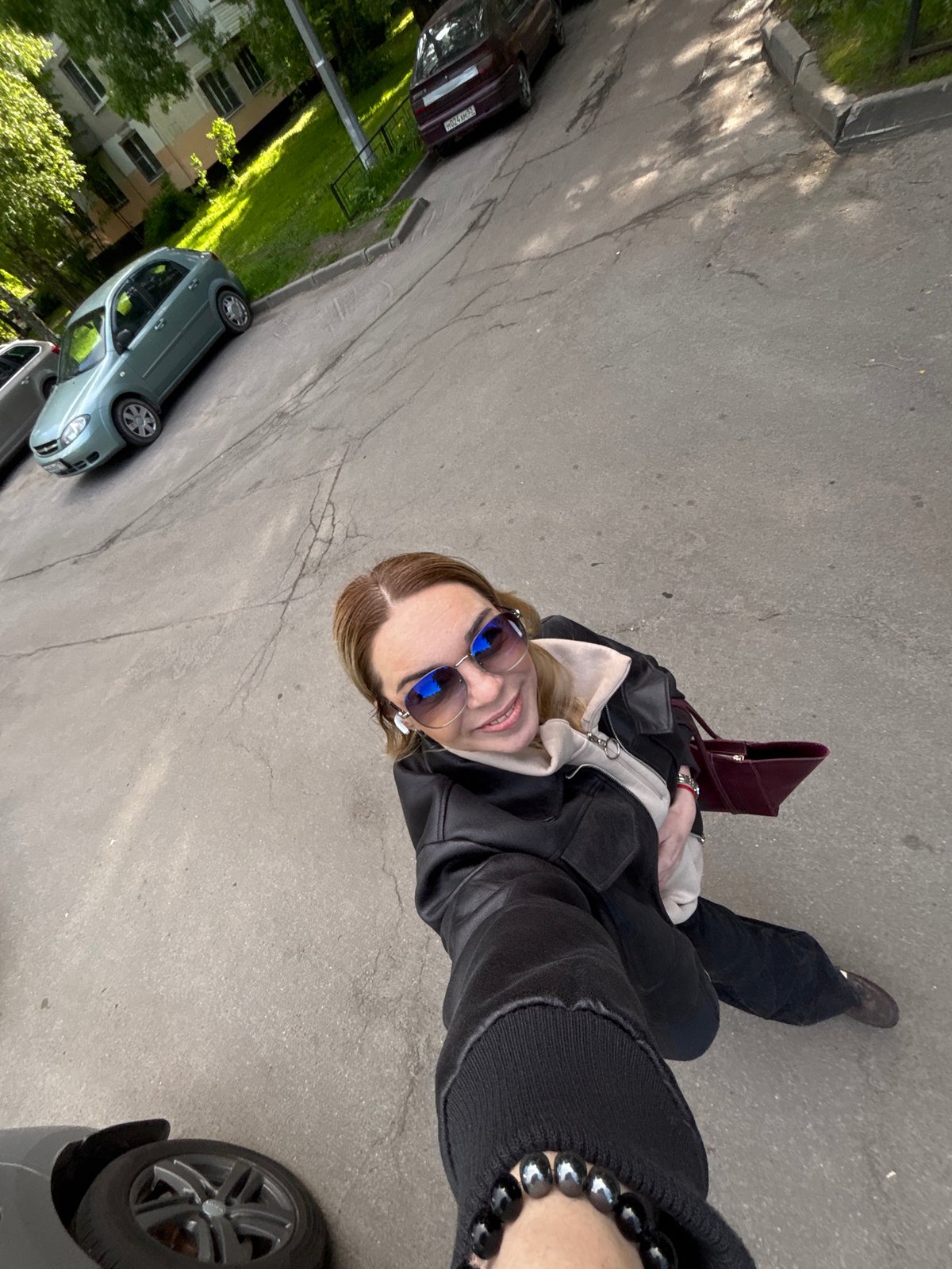 Woman photographs herself around Saint Petersburg parks and streets