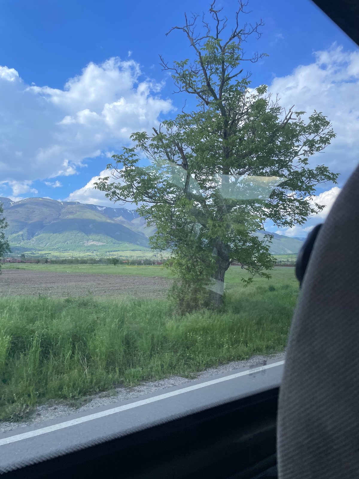 Traveler captures Bulgarian countryside views from moving vehicle