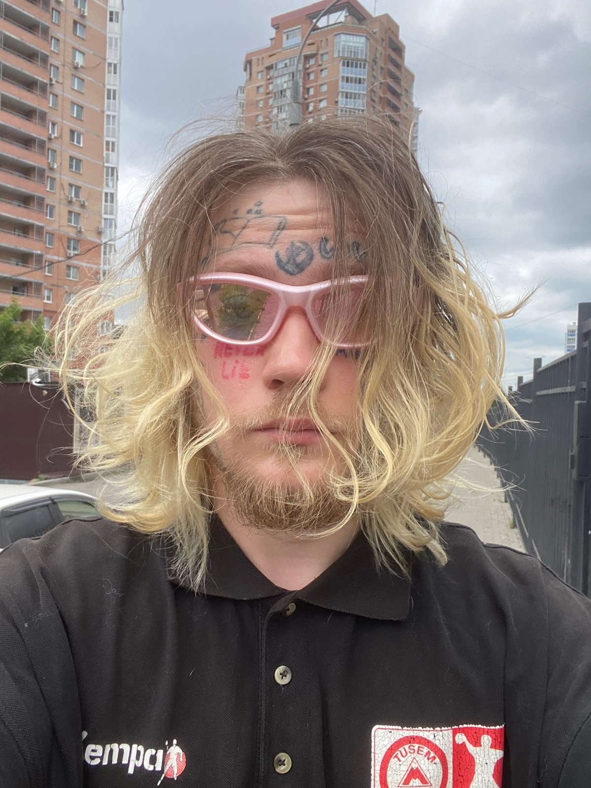 Selfie series in Khabarovsk: facial tattoos, pink shades, messy blonde hair