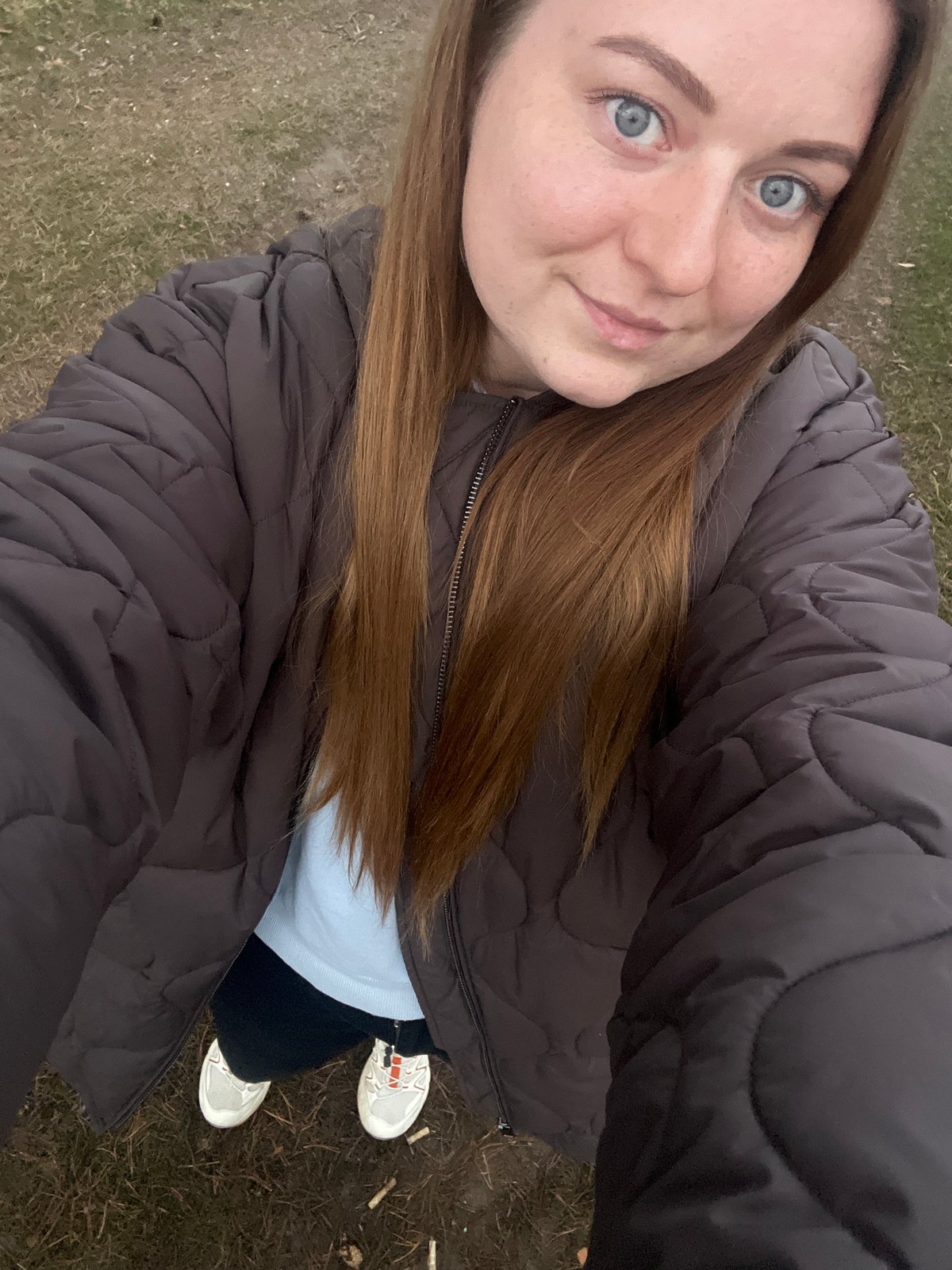 Young woman documents casual outdoor visit in rural Russia