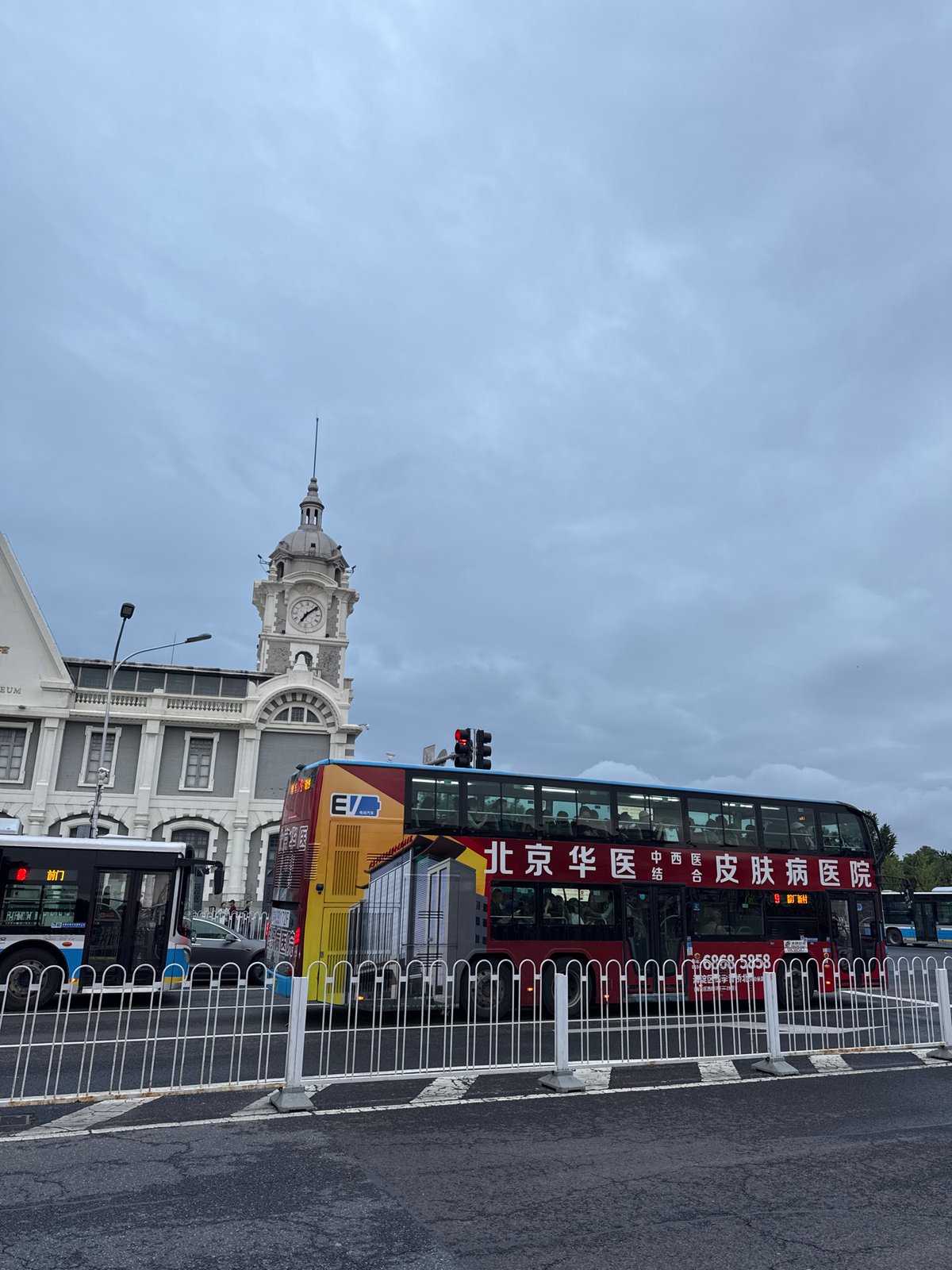 Tour bus spotted on Dongcheng District street near clock tower