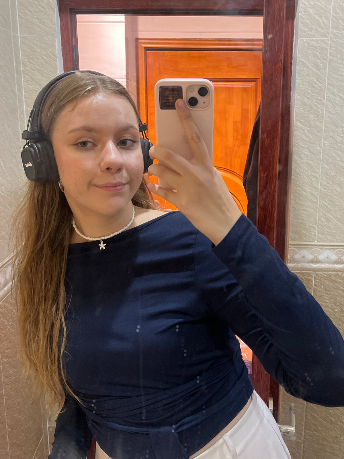 Young woman takes bathroom selfies in Thuận An, Vietnam