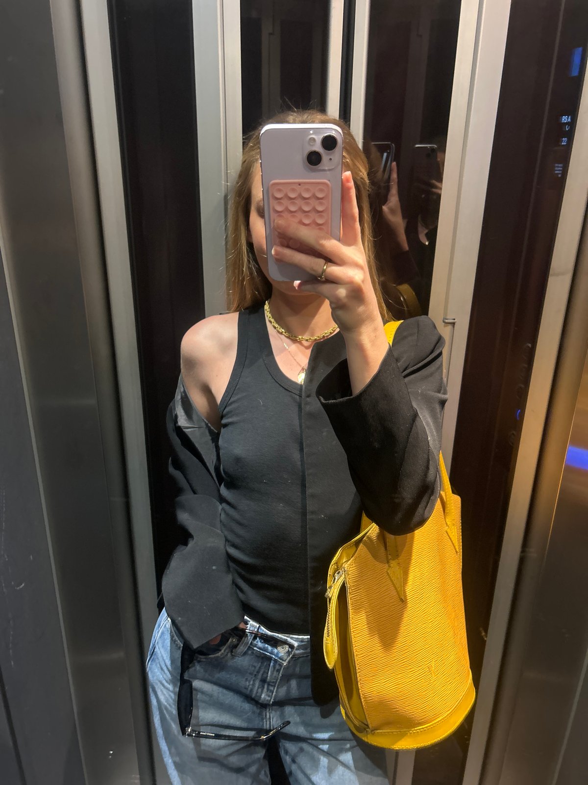 Urban scenes documented: elevator selfie, architecture, cityscape views