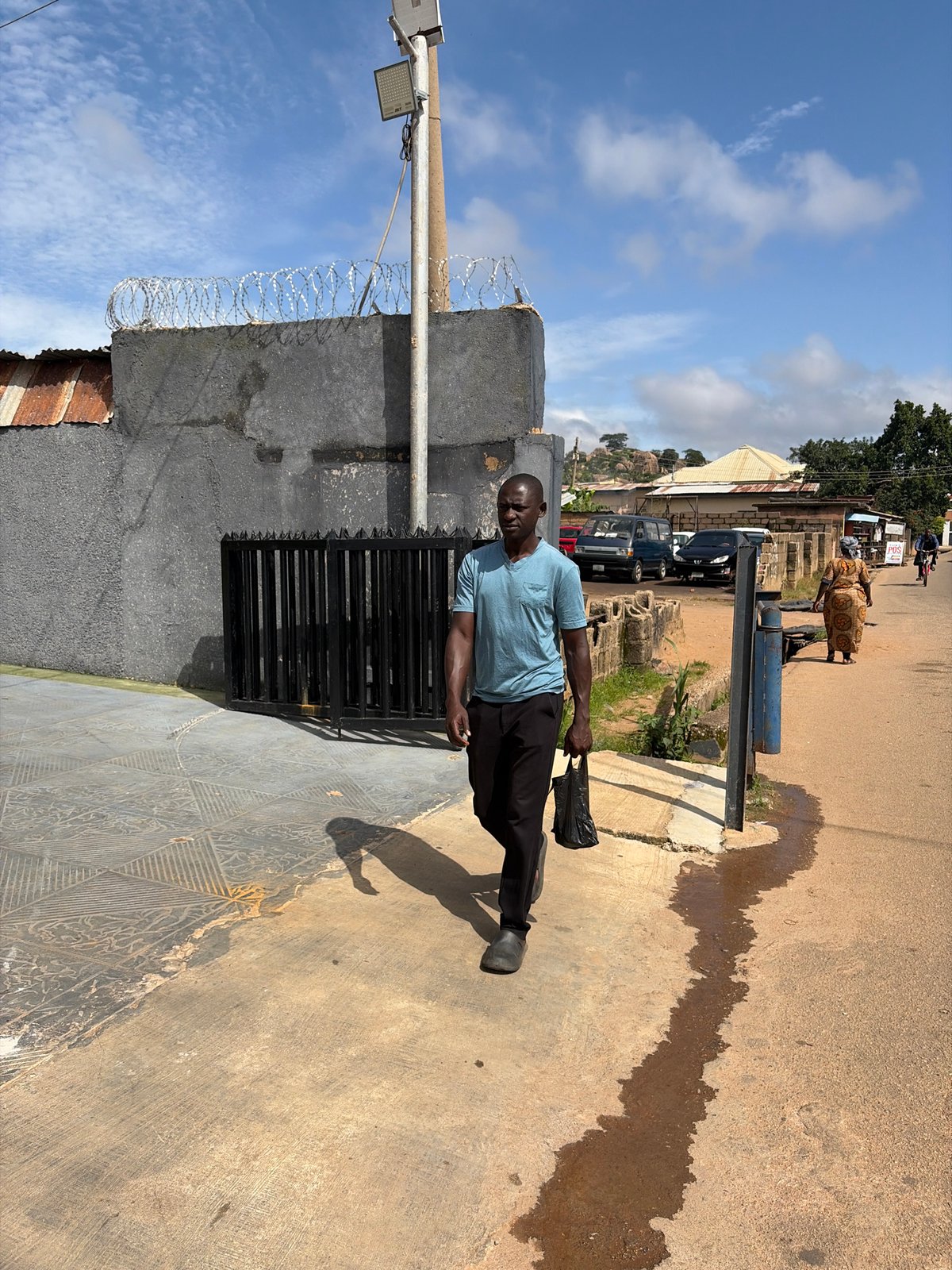 Morning foot traffic on the streets of Jos, Nigeria
