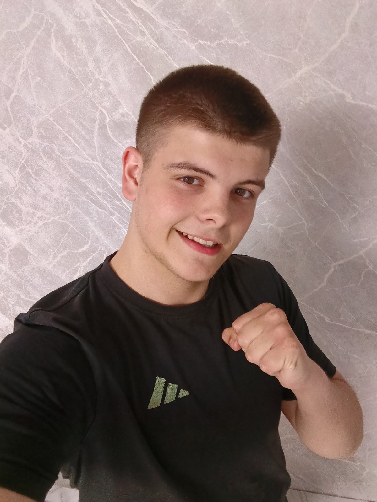 Young man poses with objects during photo session in Russia