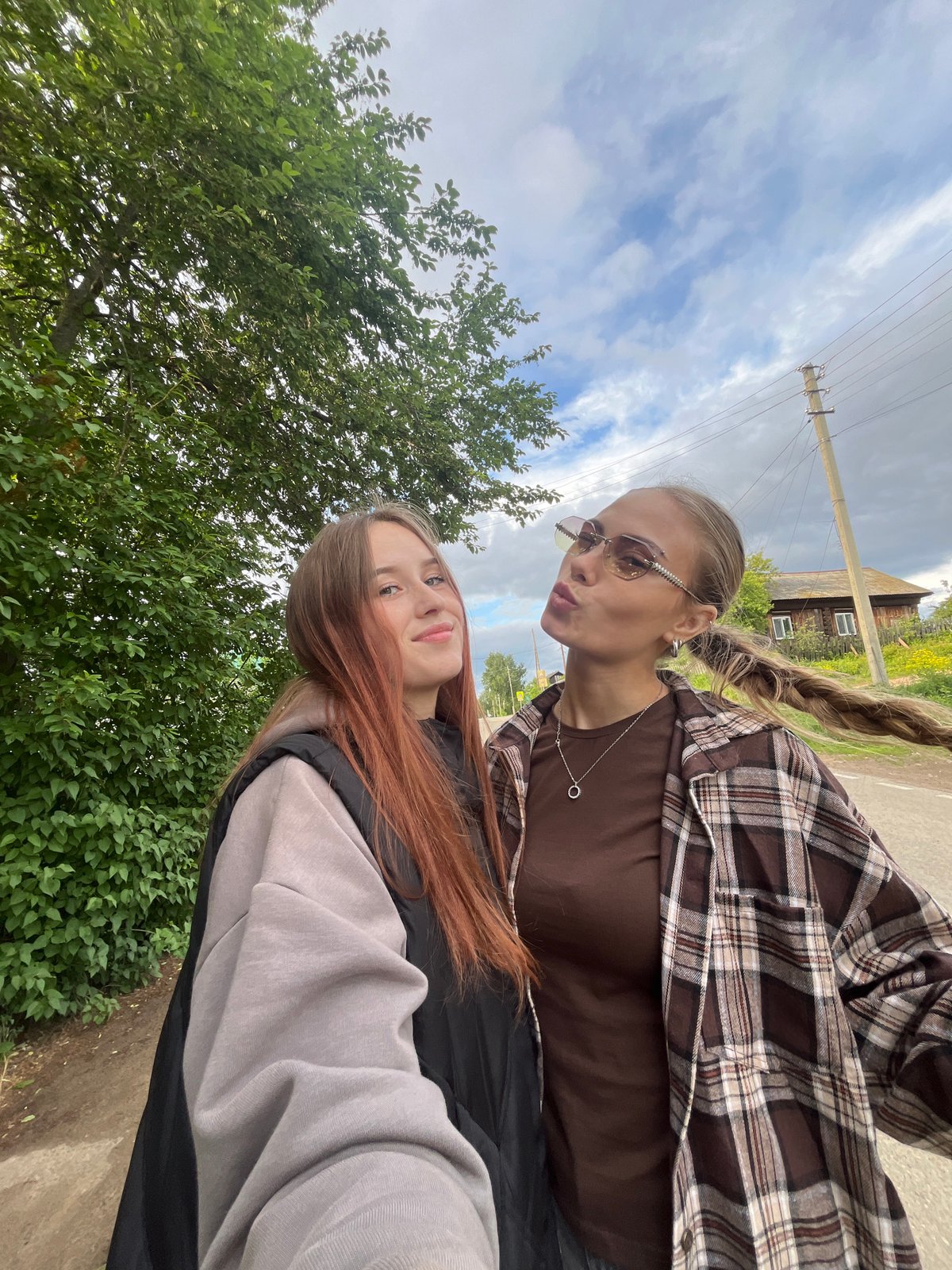 Casual family photos captured during outdoor gathering in rural Russia