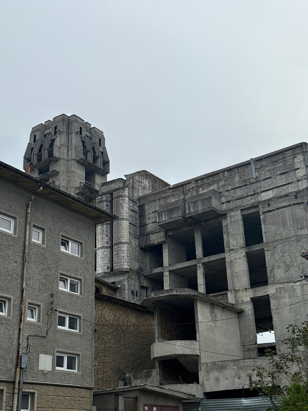 Man drinks energy drink while walking through Shumen, Bulgaria