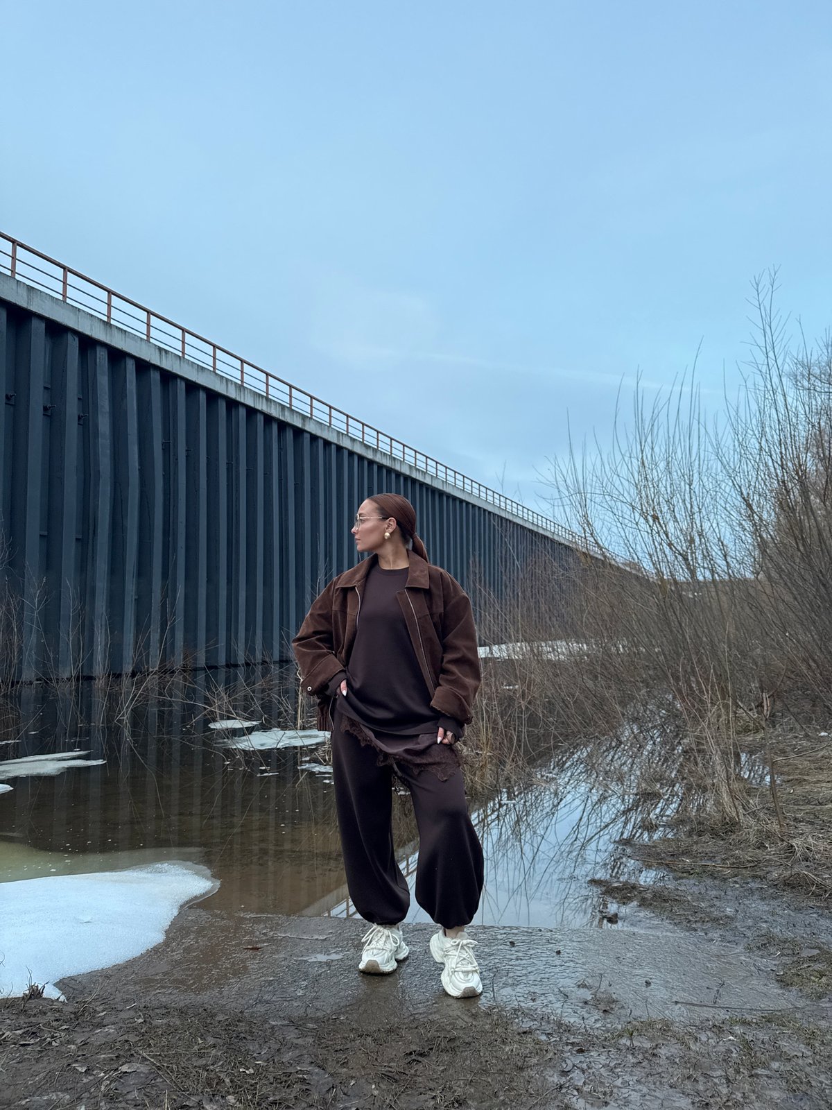 Woman spotted by water near structure in Chaikovsky, Russia