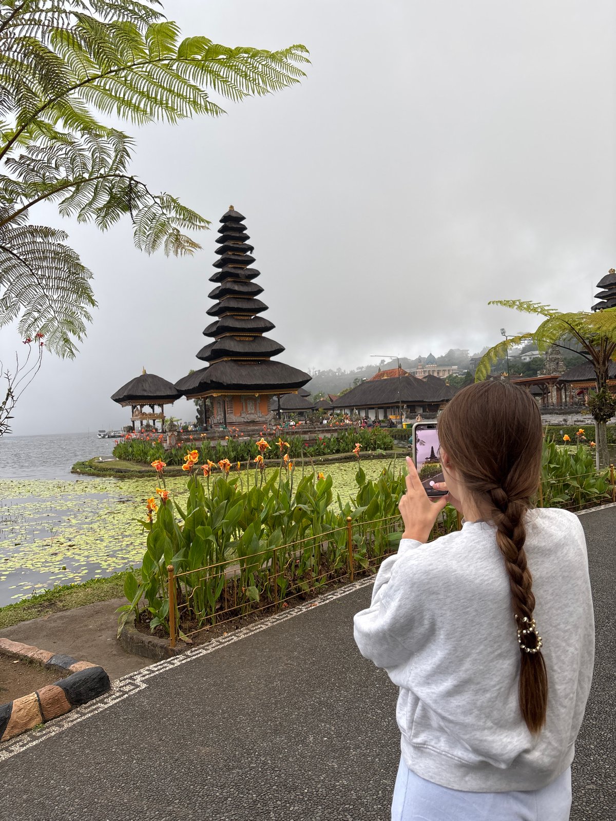 Tourists visit iconic Ulun Danu Beratan Temple in Bali