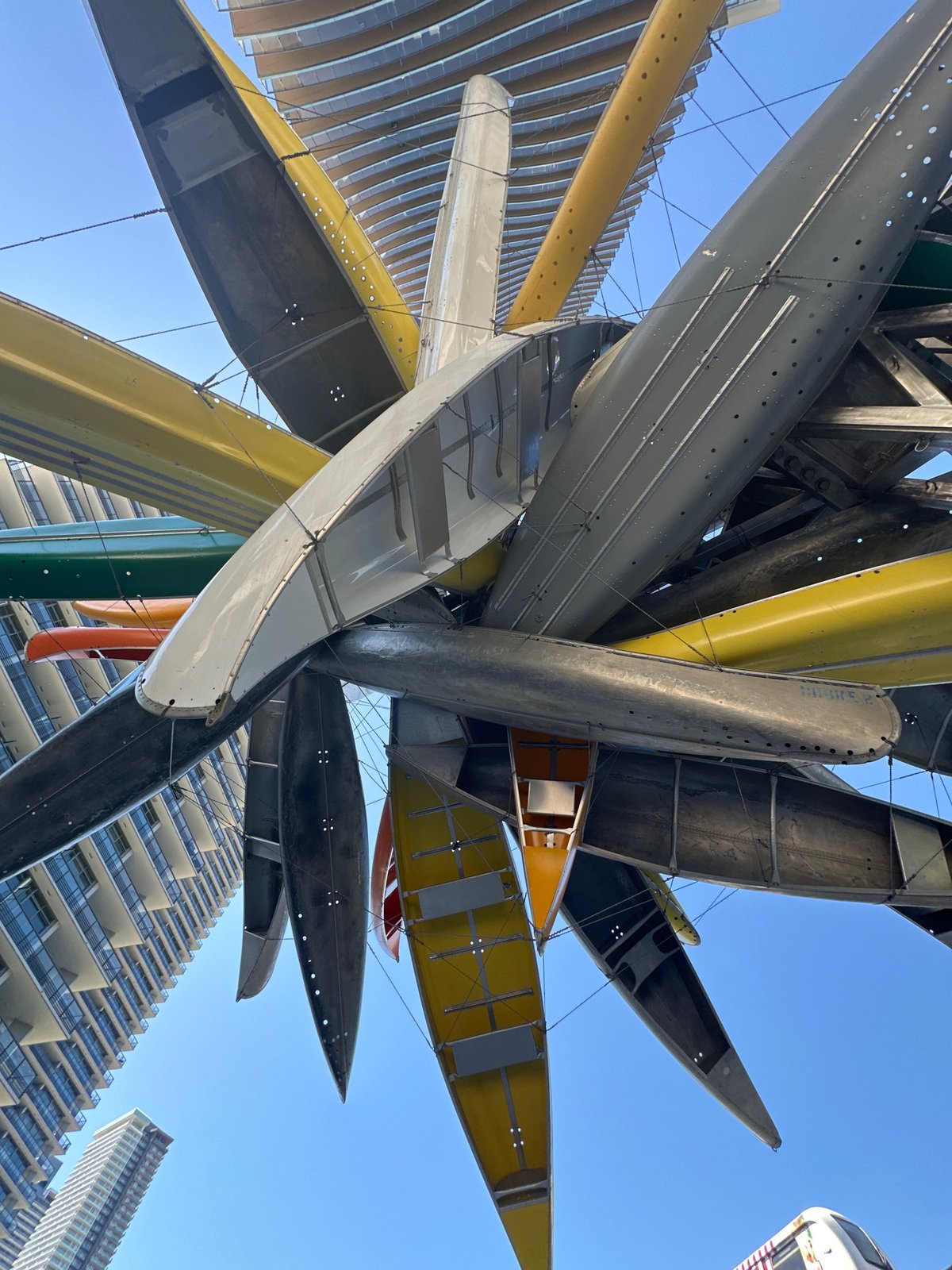 Burnaby urban walk: canoe sculpture, SkyTrain, towers, and juggling