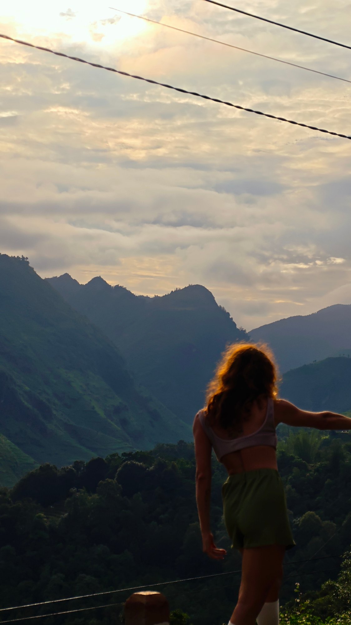 Tourist visits scenic mountain views in northern Vietnam commune