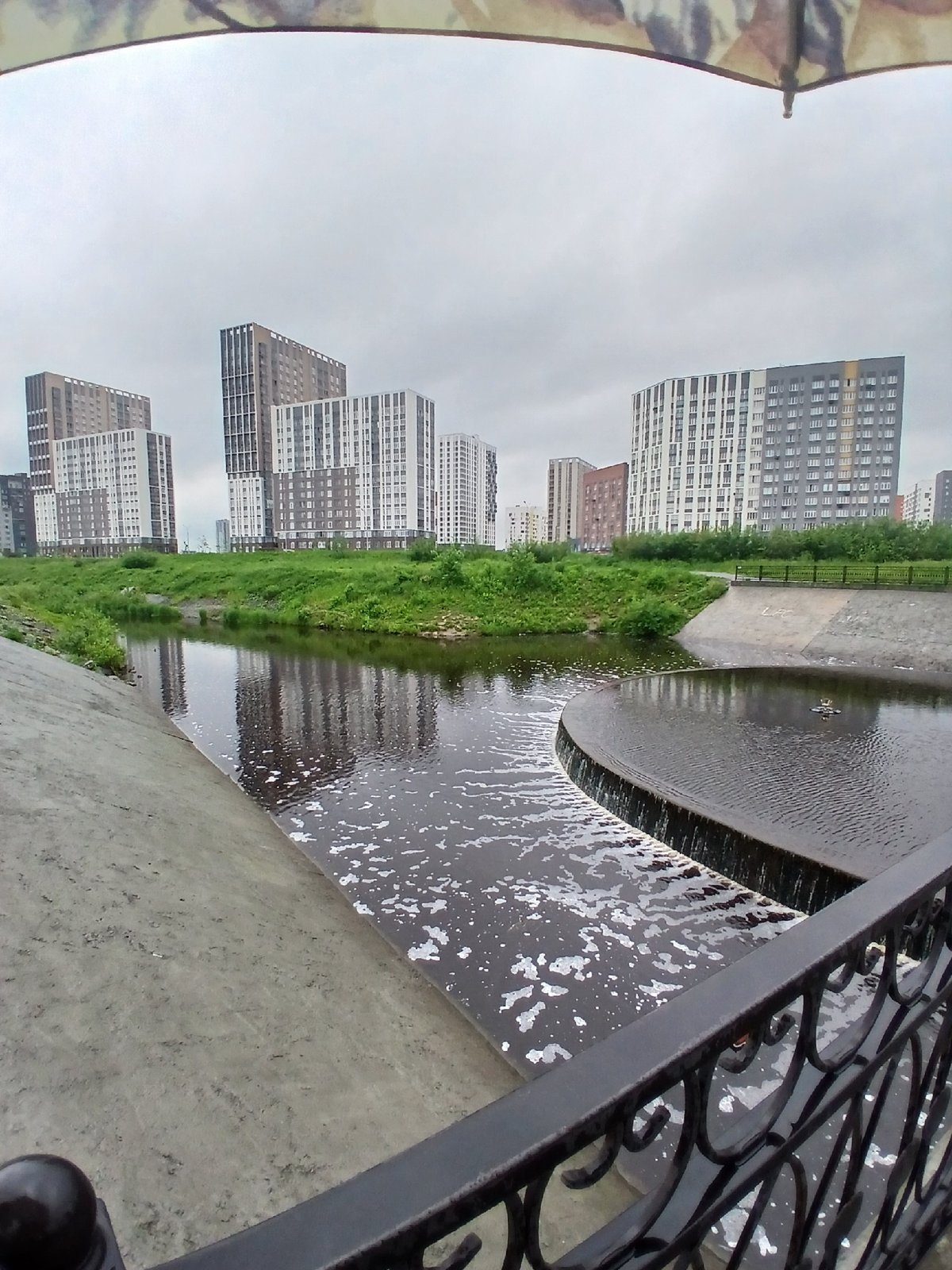 Morning walk documented along Yekaterinburg's Iset River embankment