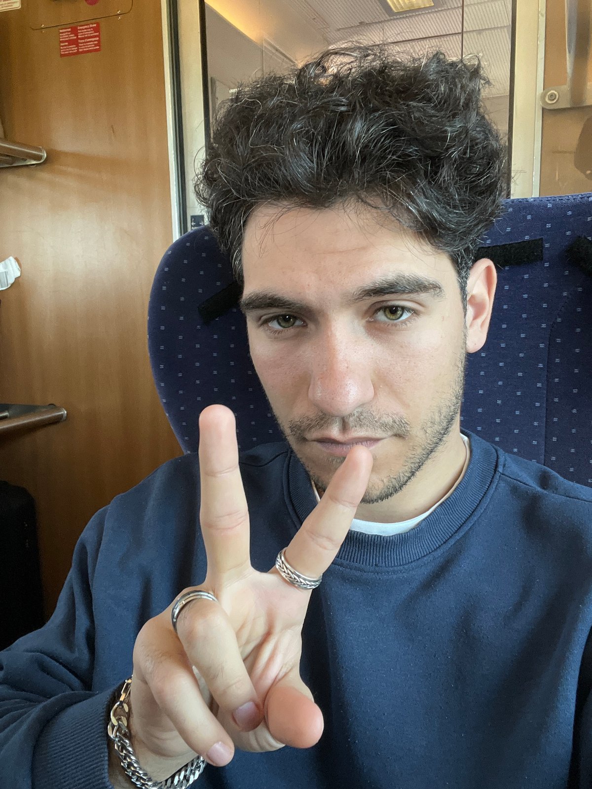 Young man poses for photo aboard train in Telish