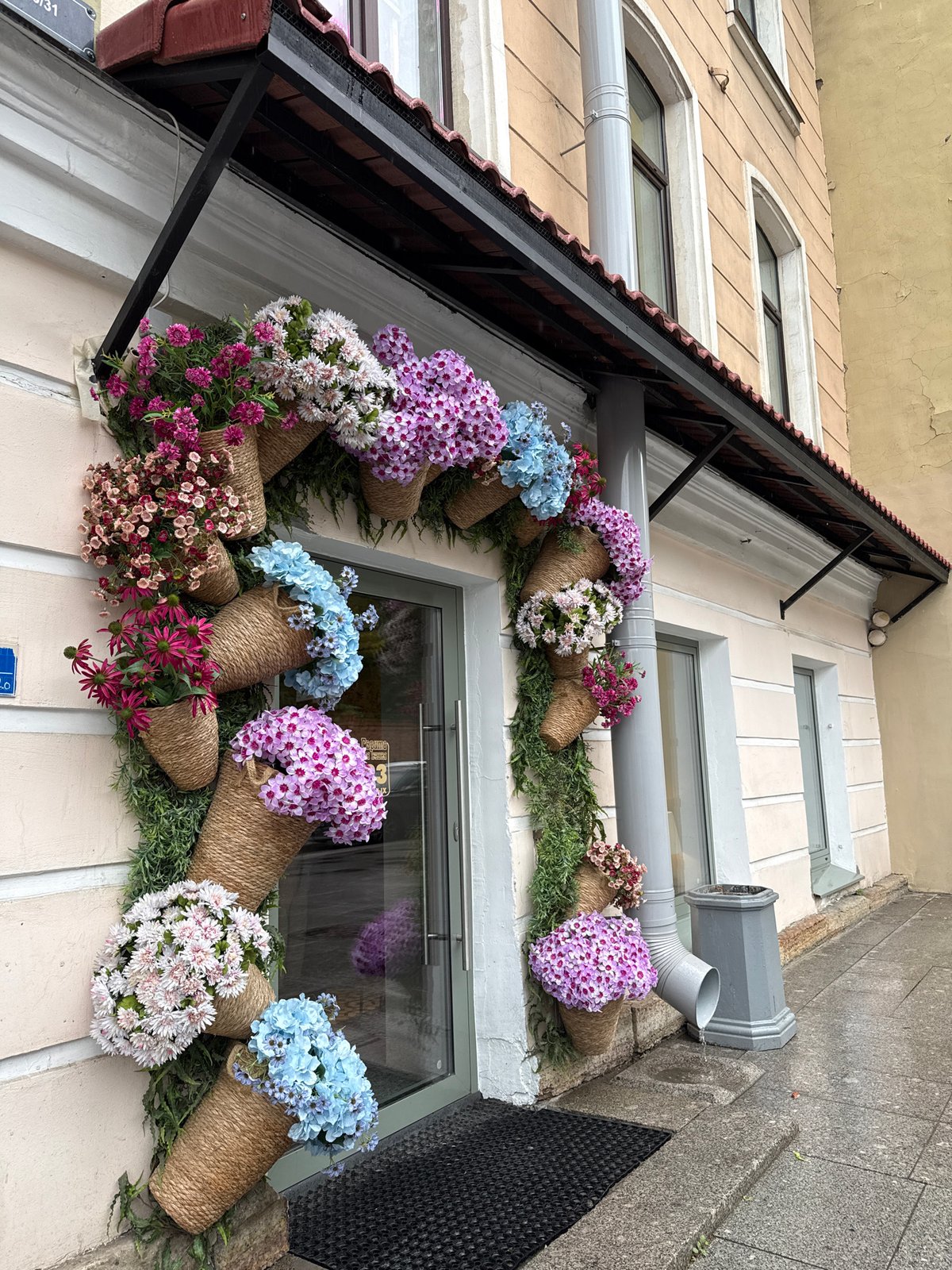 Flower containers adorn Saint Petersburg building facade