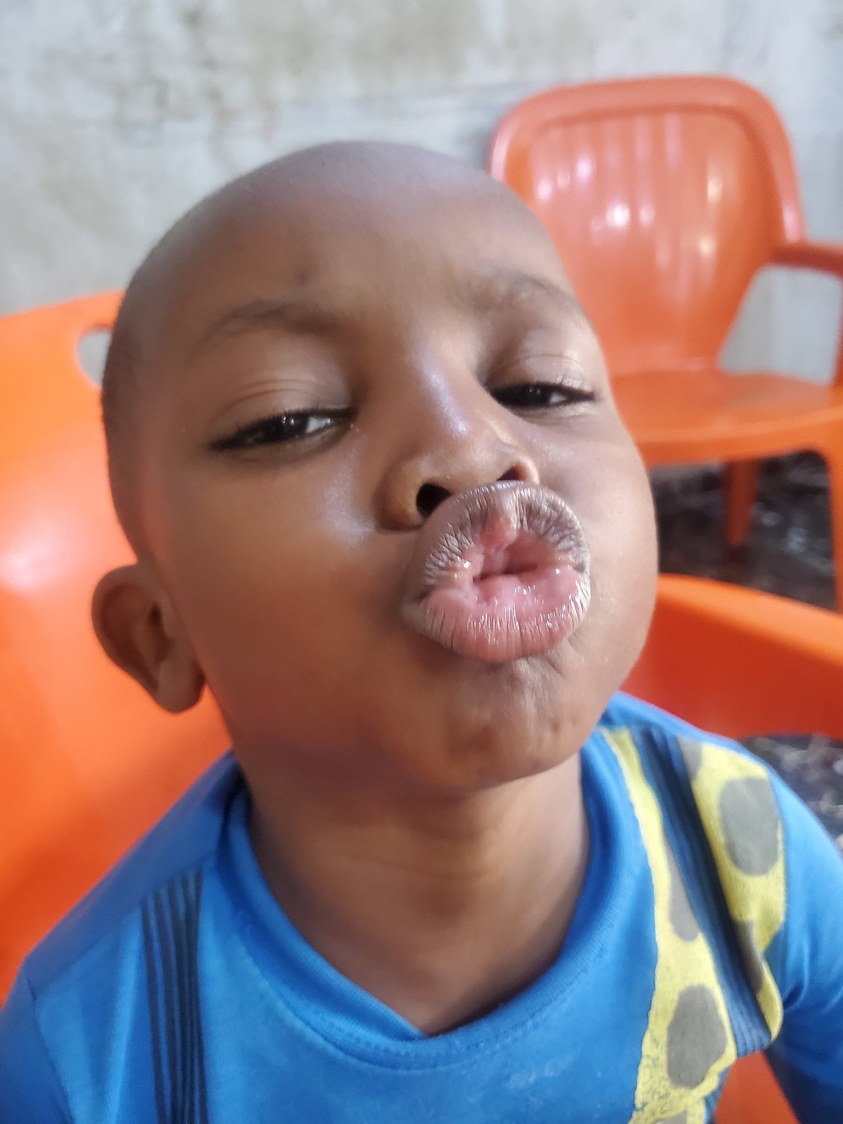Playful close-up portraits of a child in Jos, Nigeria