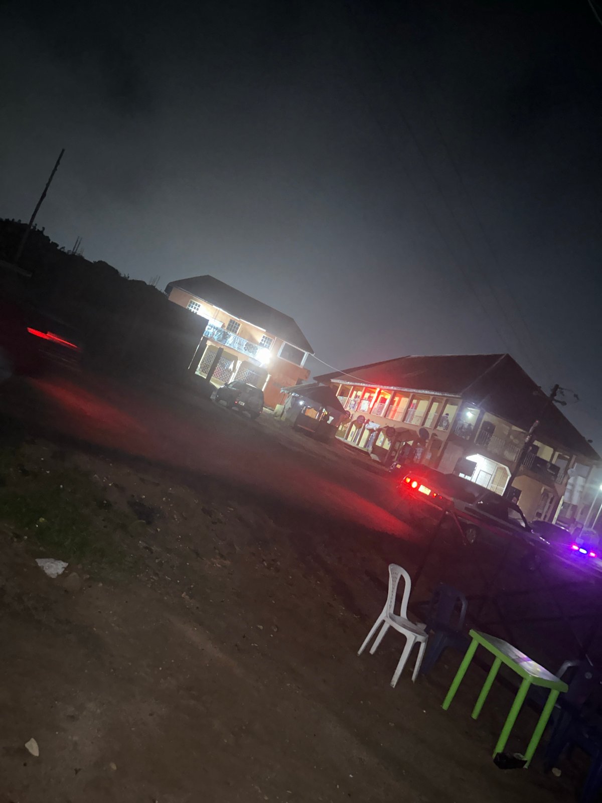 Nighttime grilling session outside Jos building
