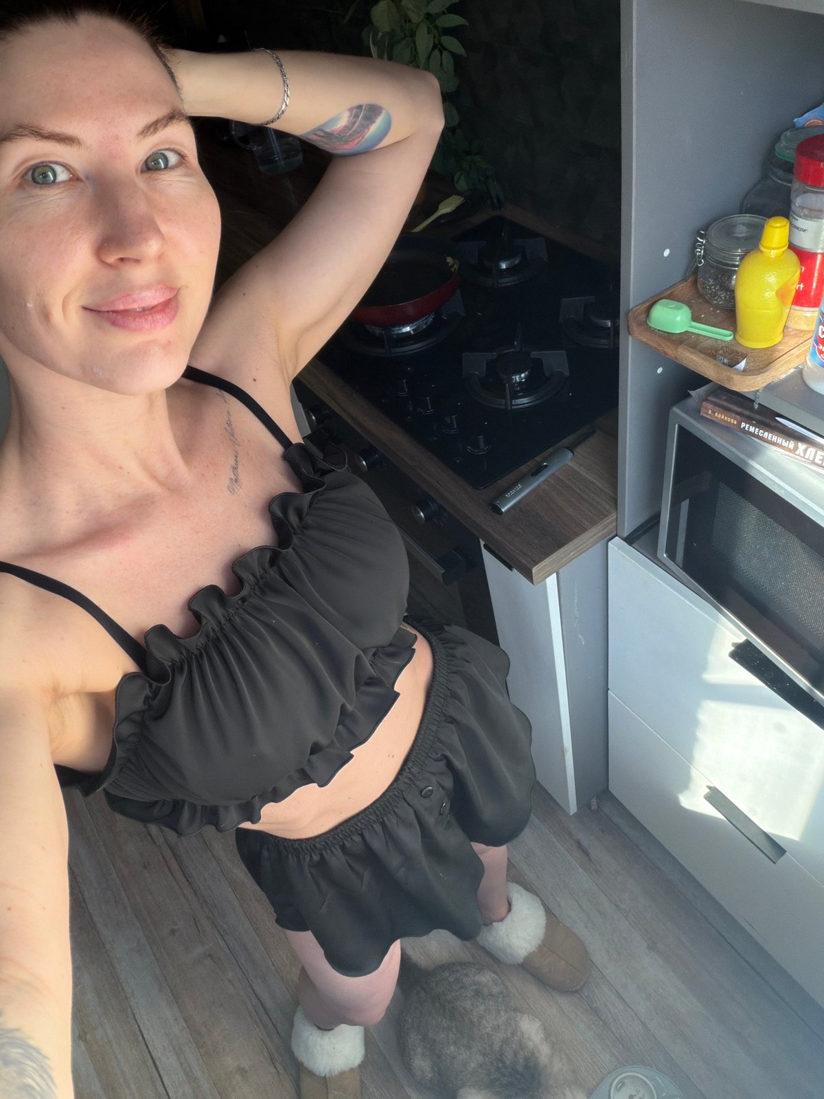 Woman takes kitchen floor selfie in Perm, Russia