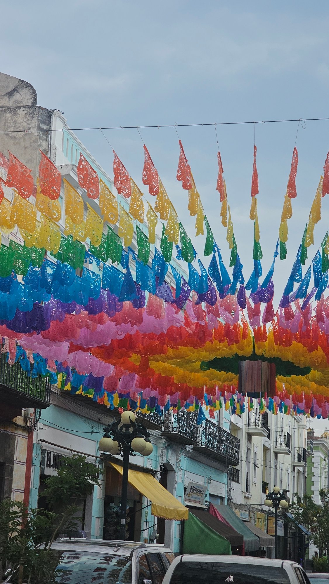 Festive Puebla streets decorated with traditional papel picado banners