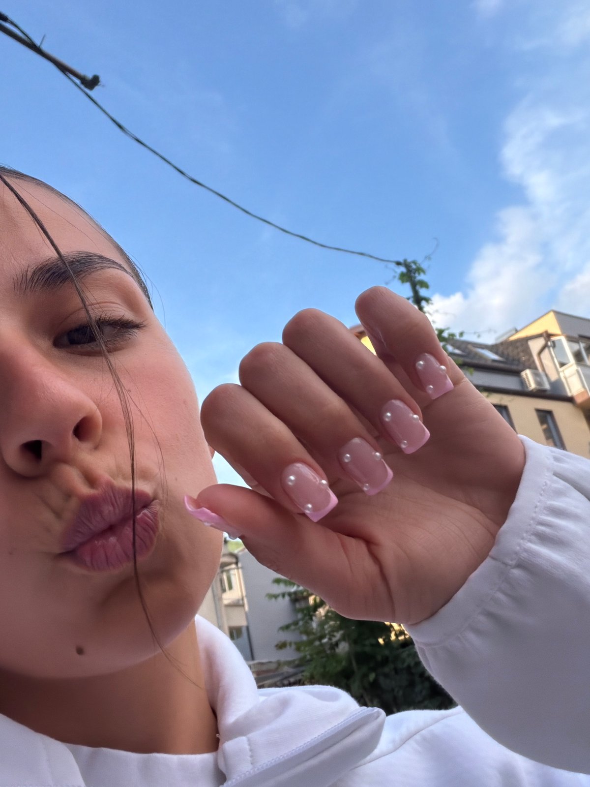 Woman documents beauty routine with selfies in Gabrovo, Bulgaria