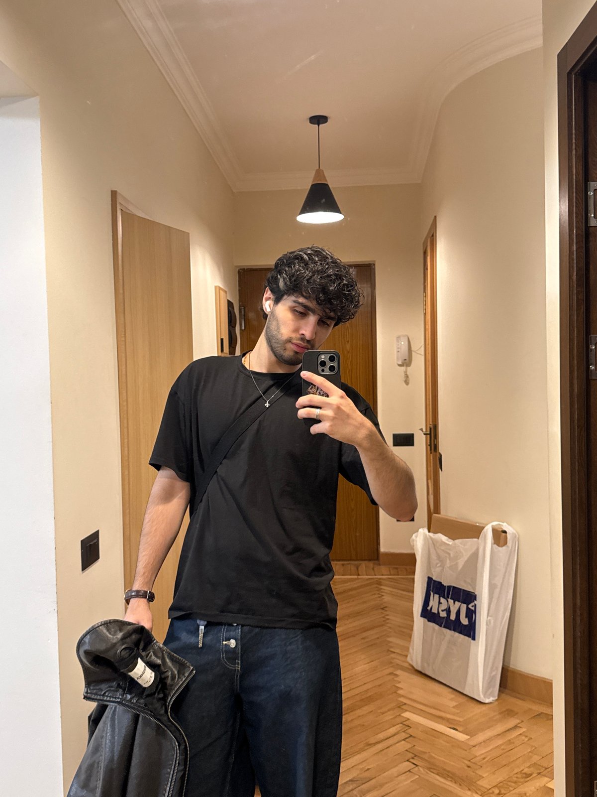 Man takes selfie in hotel hallway in Yerevan