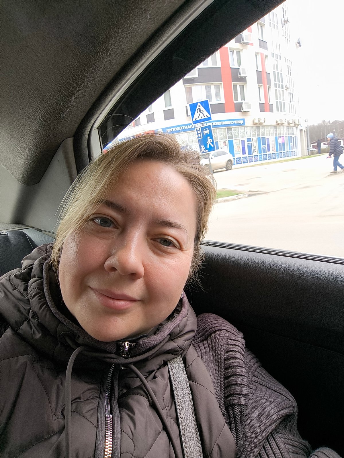 Woman travels as passenger in car through Khimki