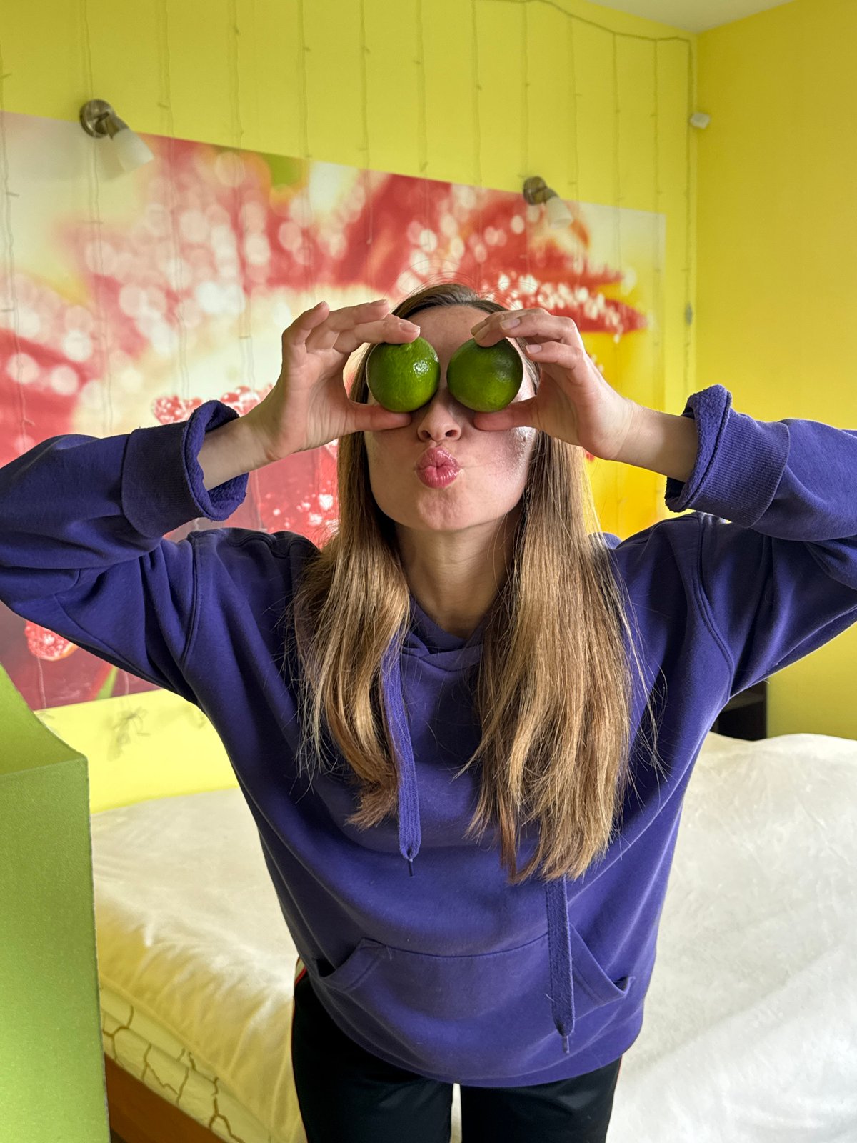 Person plays with limes indoors in Прикамский, Russia