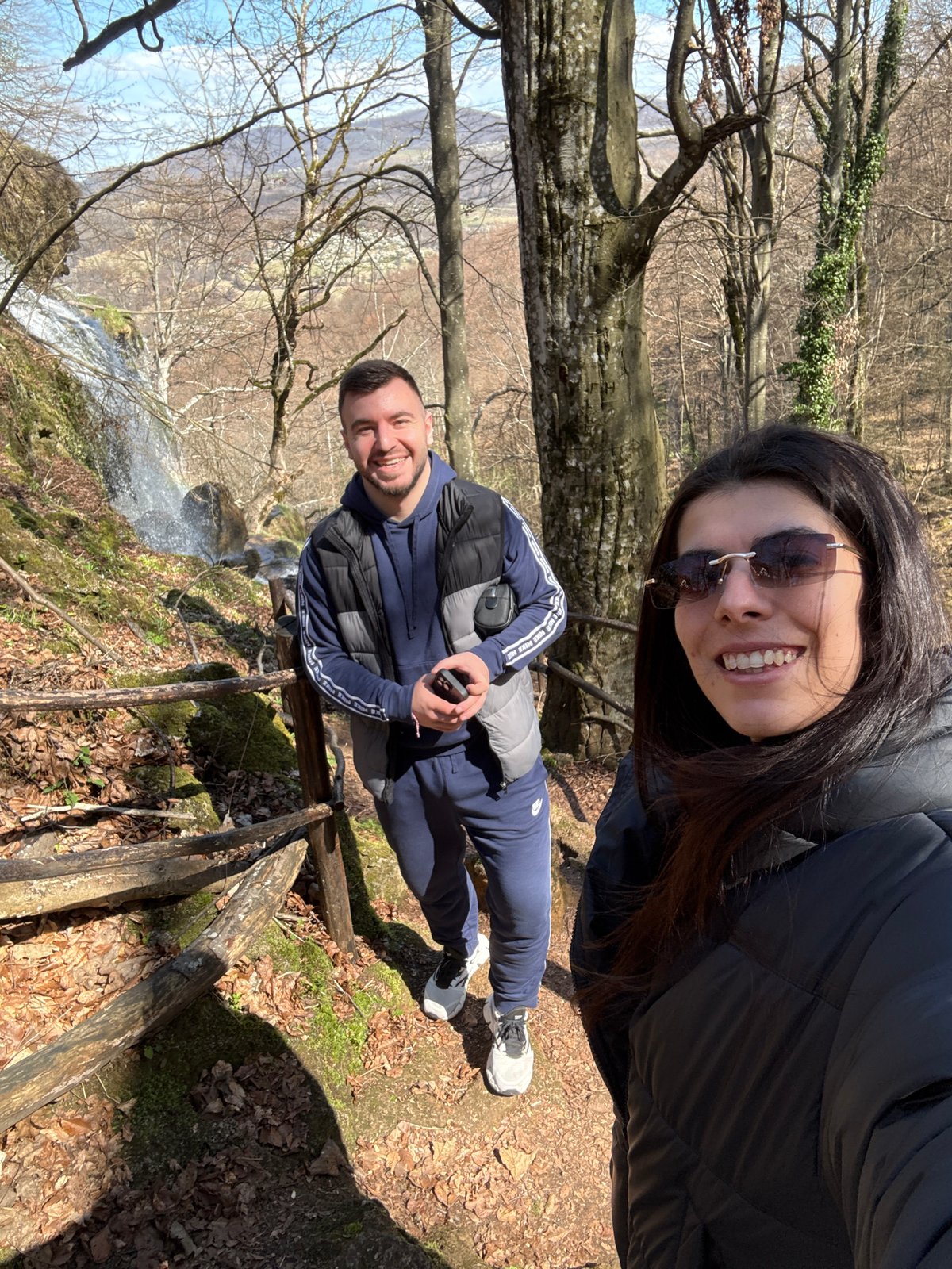Tourists photograph waterfall visit in Ribaritsa, Bulgaria