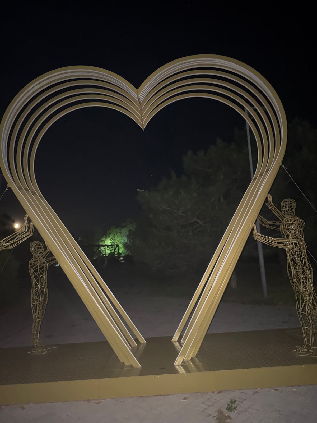 Evening in a Egorlykskaya park built around a golden heart sculpture