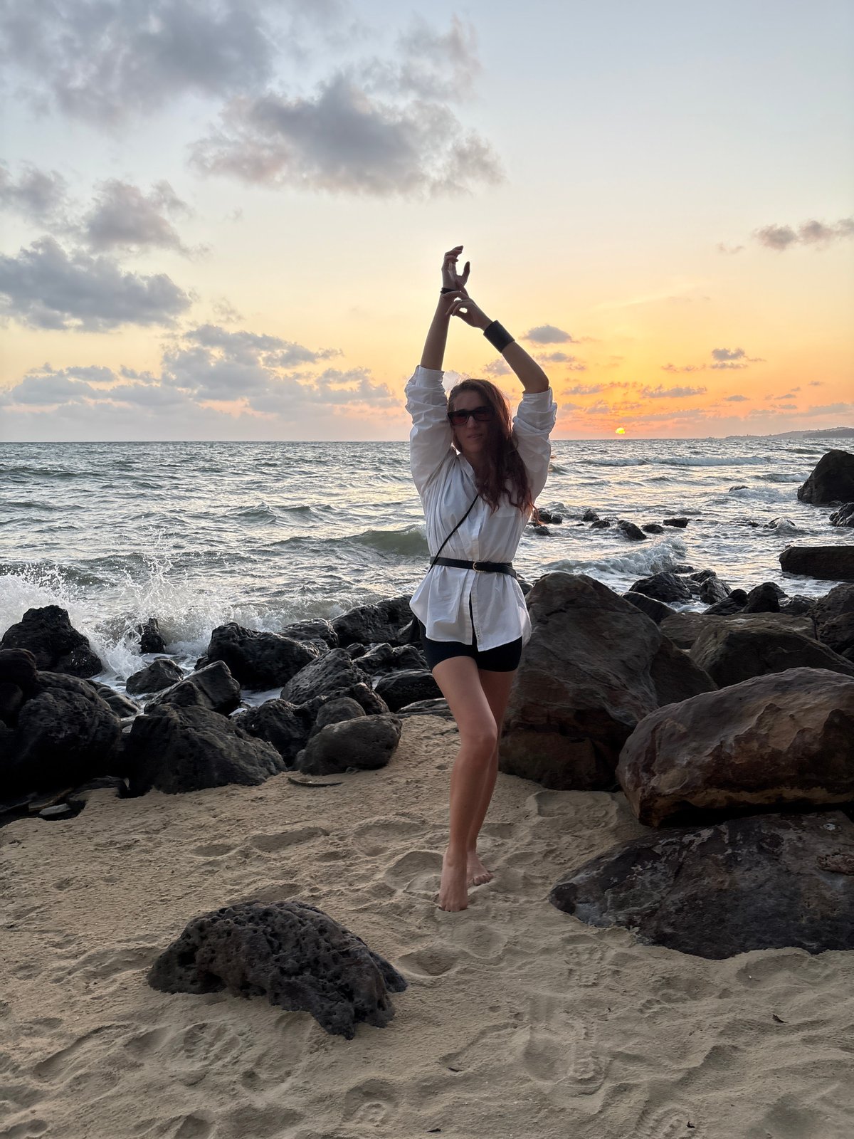 Sunset selfies and seascape shots on a rocky beach