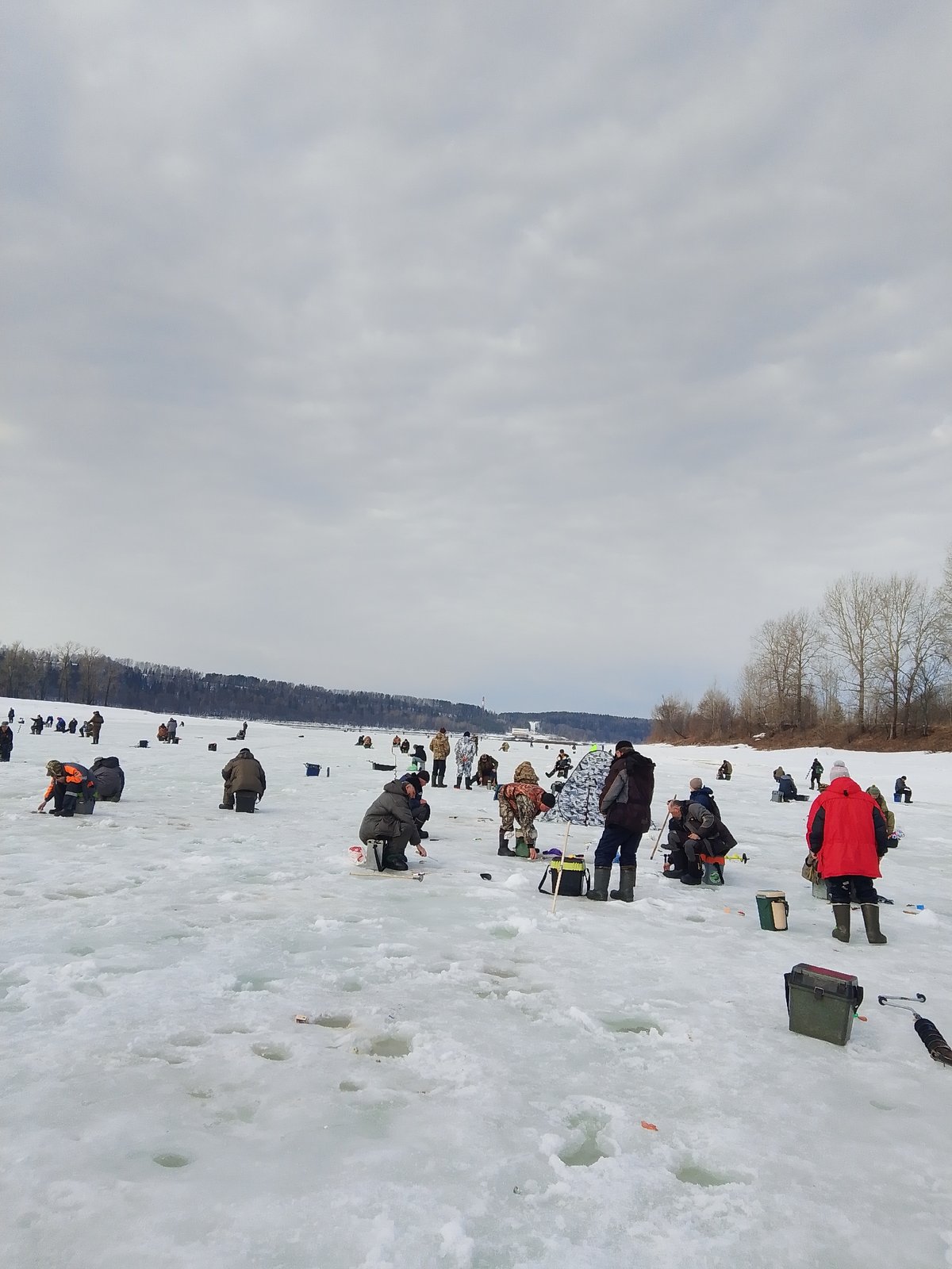 Ice fishing activity observed on frozen water in Russia