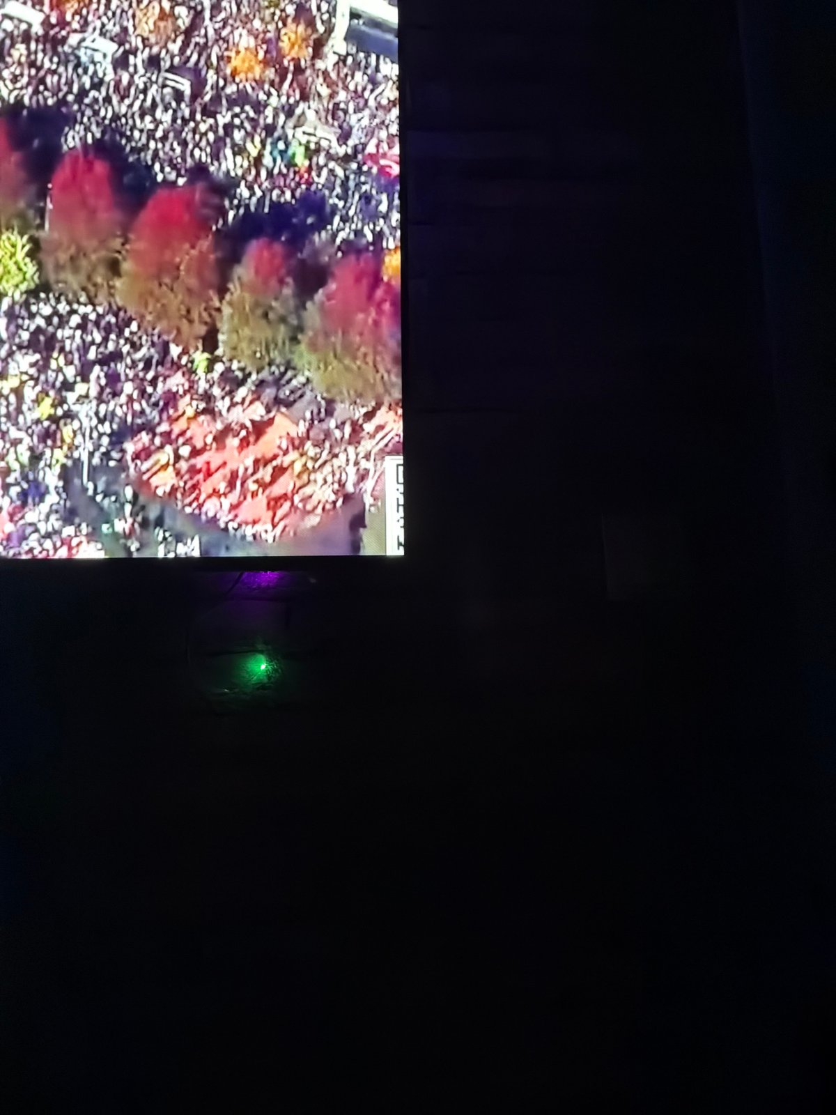 Television displays show crowds, maps in Velingrad, Bulgaria