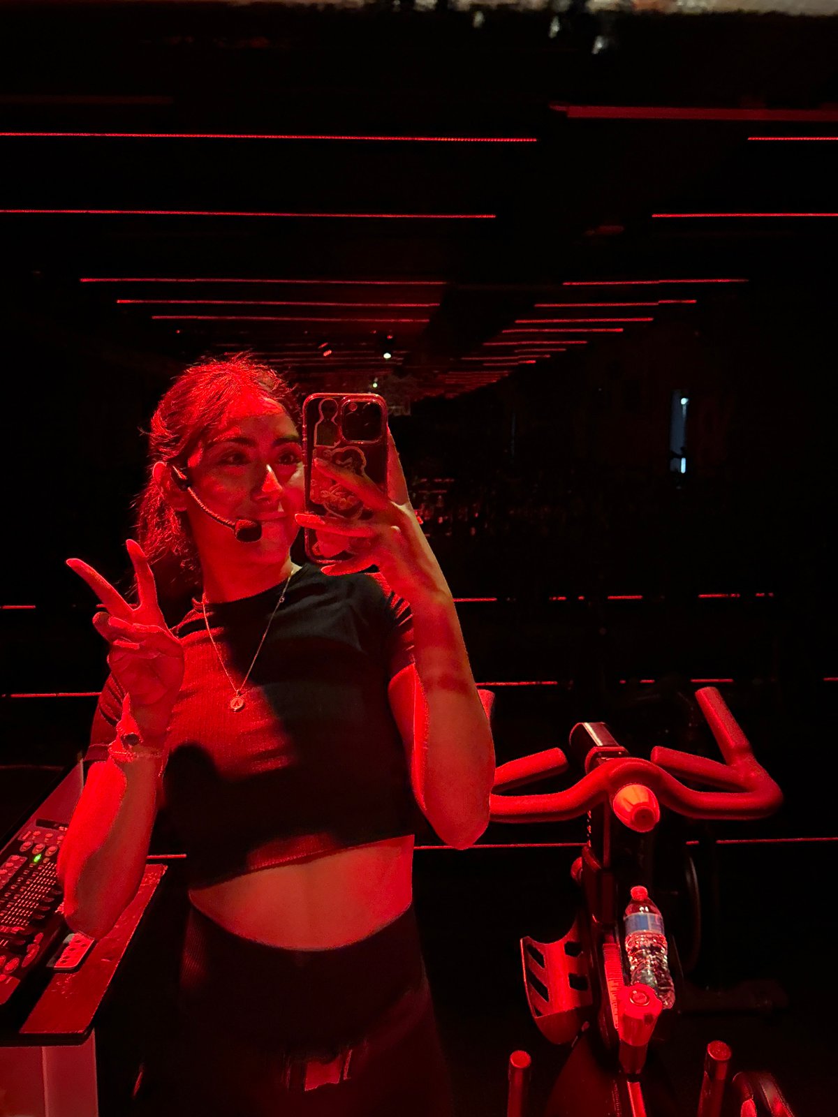 Woman takes selfie in fitness studio in Puebla