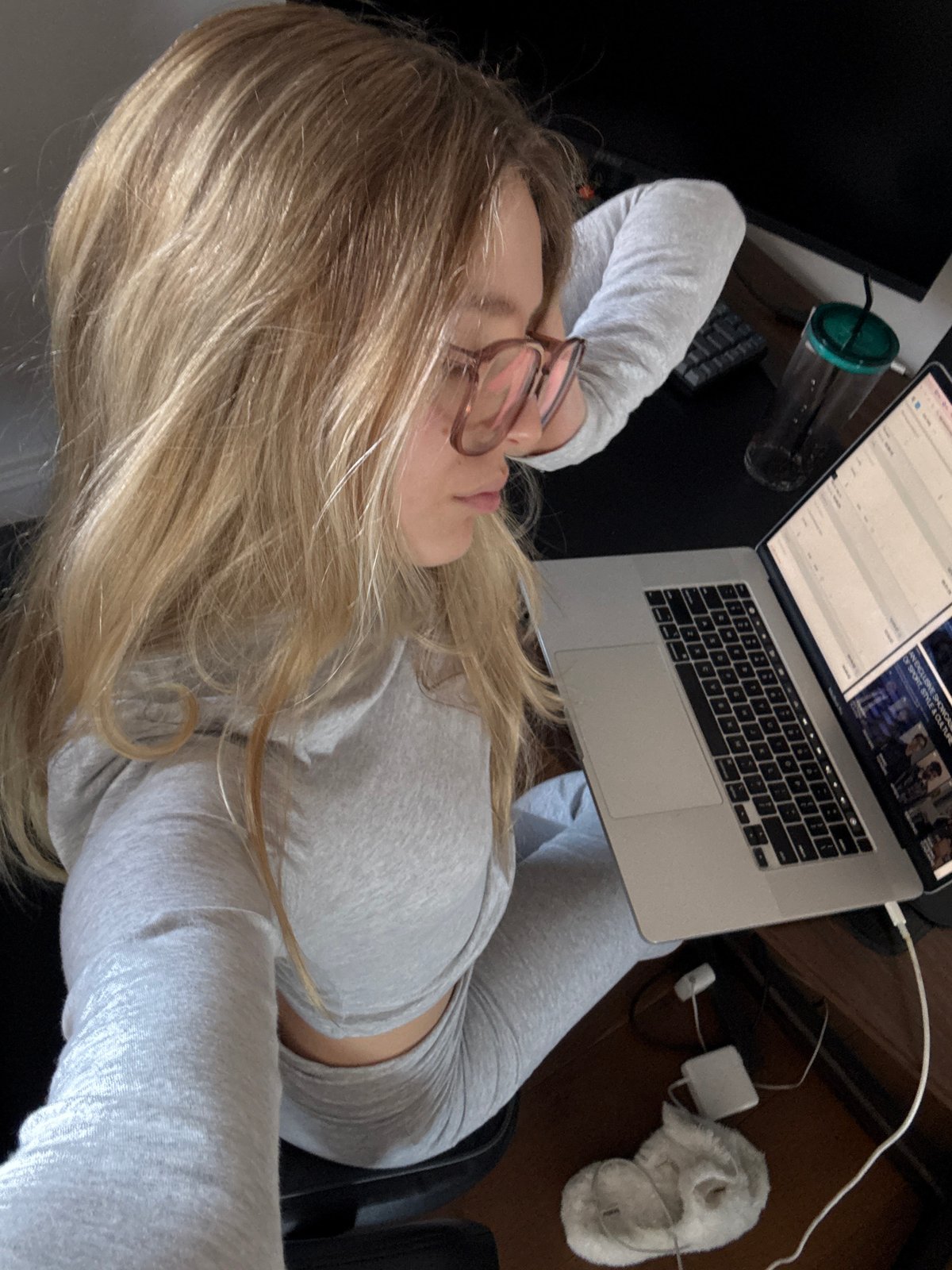 Woman works on laptop in office chair, Mexico City