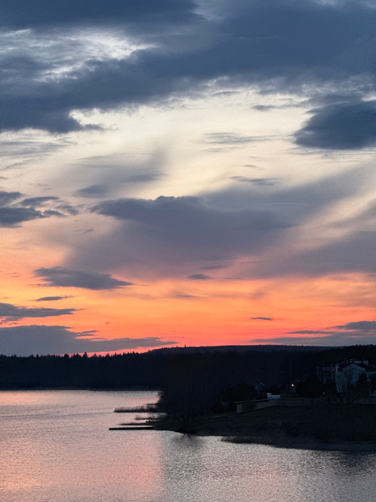 Dramatic sunset captured over water in Votkinsk, Russia