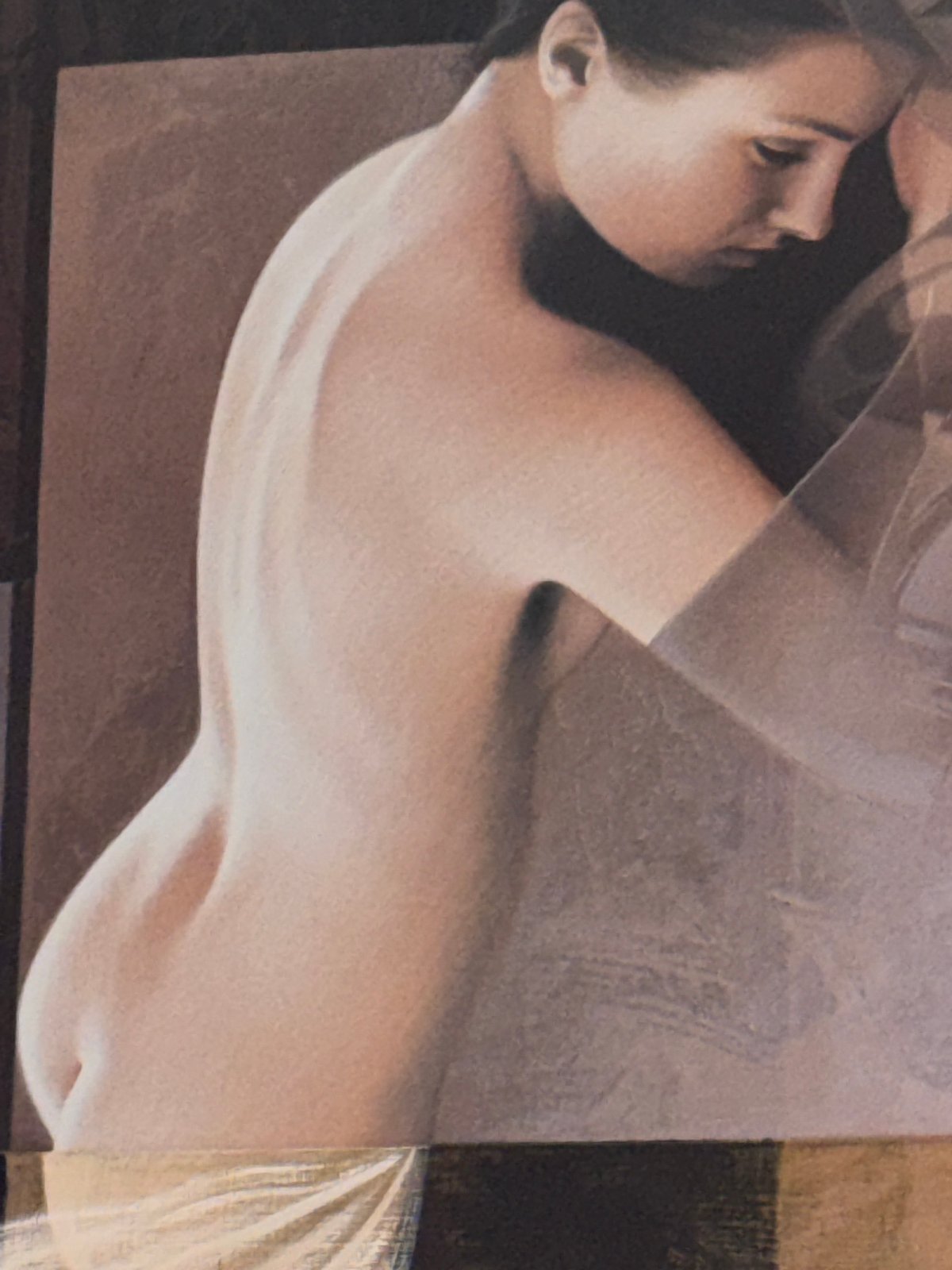 Woman photographed lying down with translucent covering