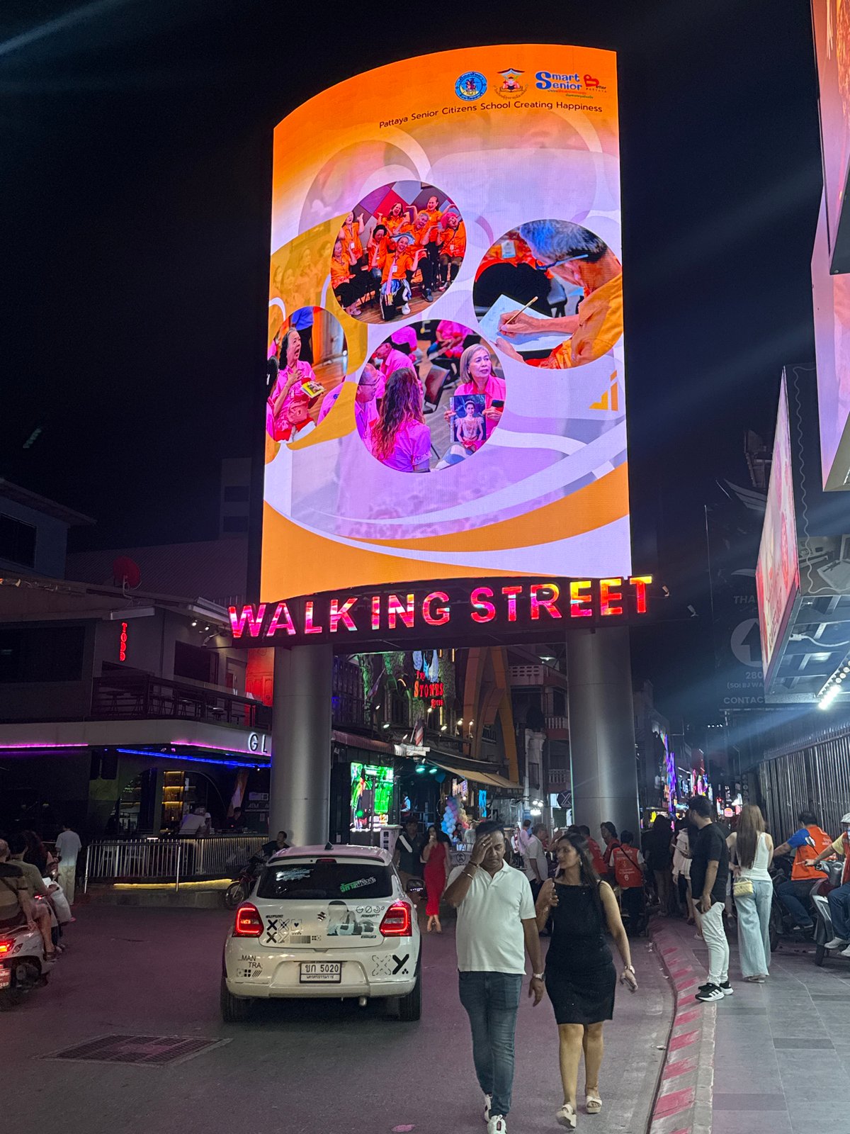 Evening crowds gather on Pattaya's illuminated Walking Street