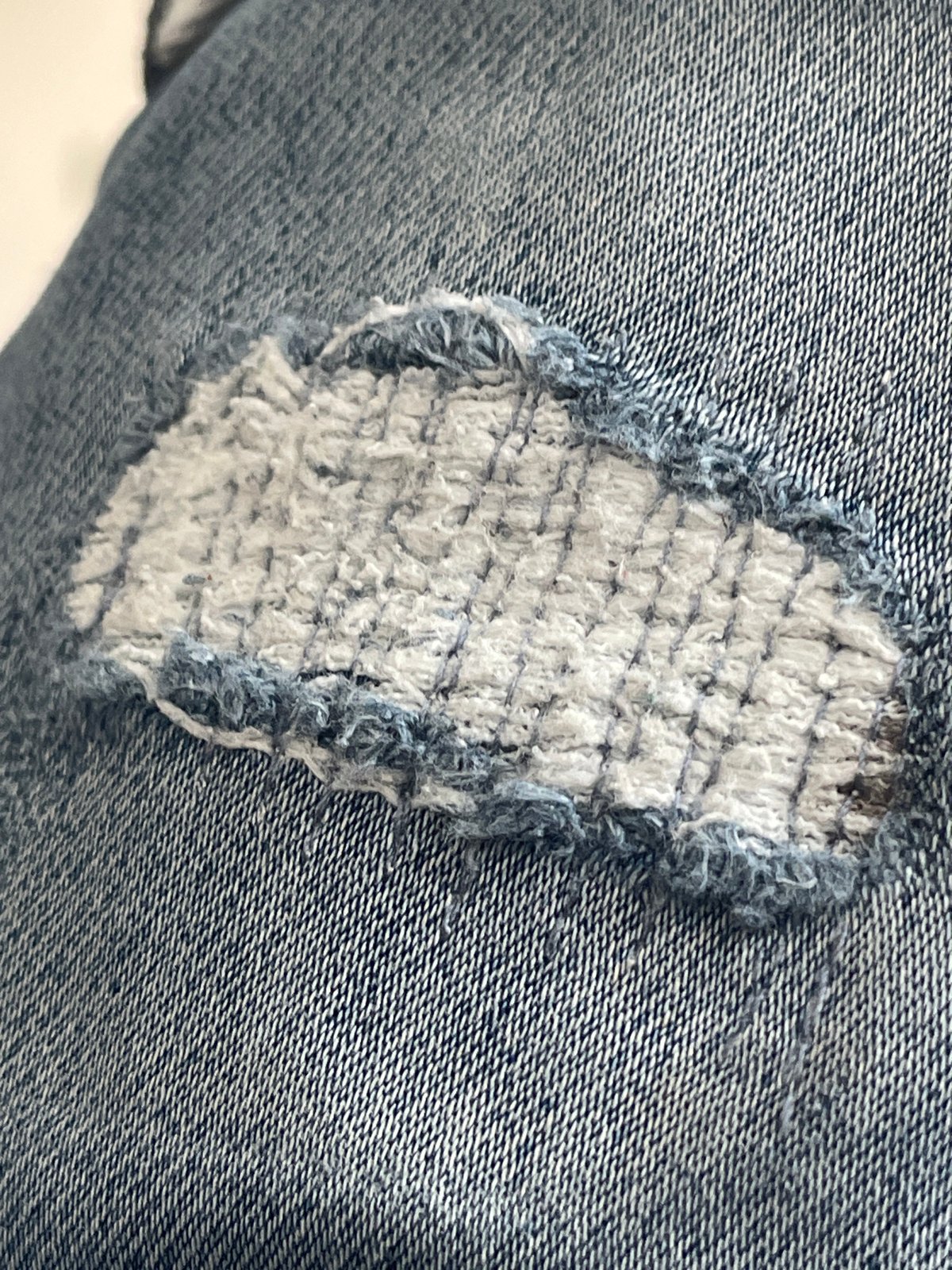 Patched jeans and a Roblox menu, captured seconds apart