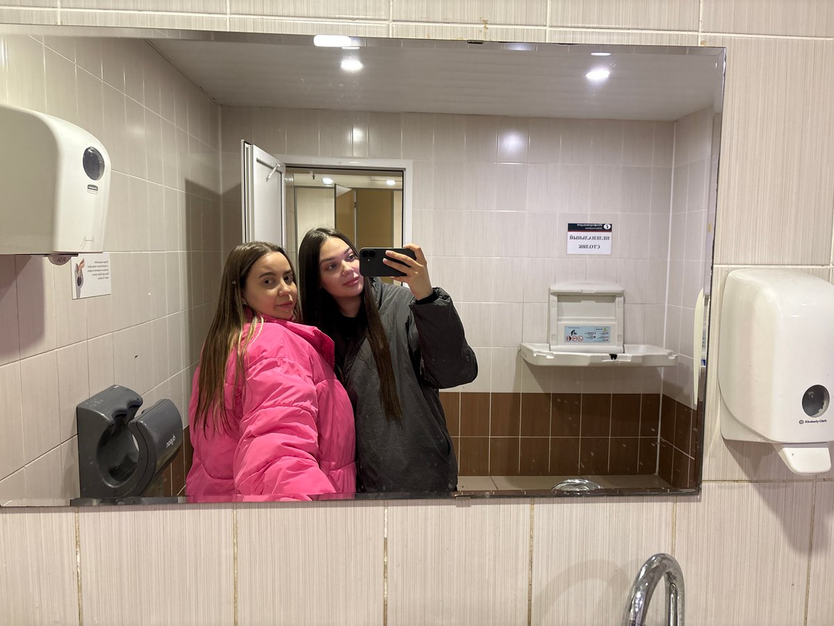 Late-night travelers documented at Izhevsk train station with luggage