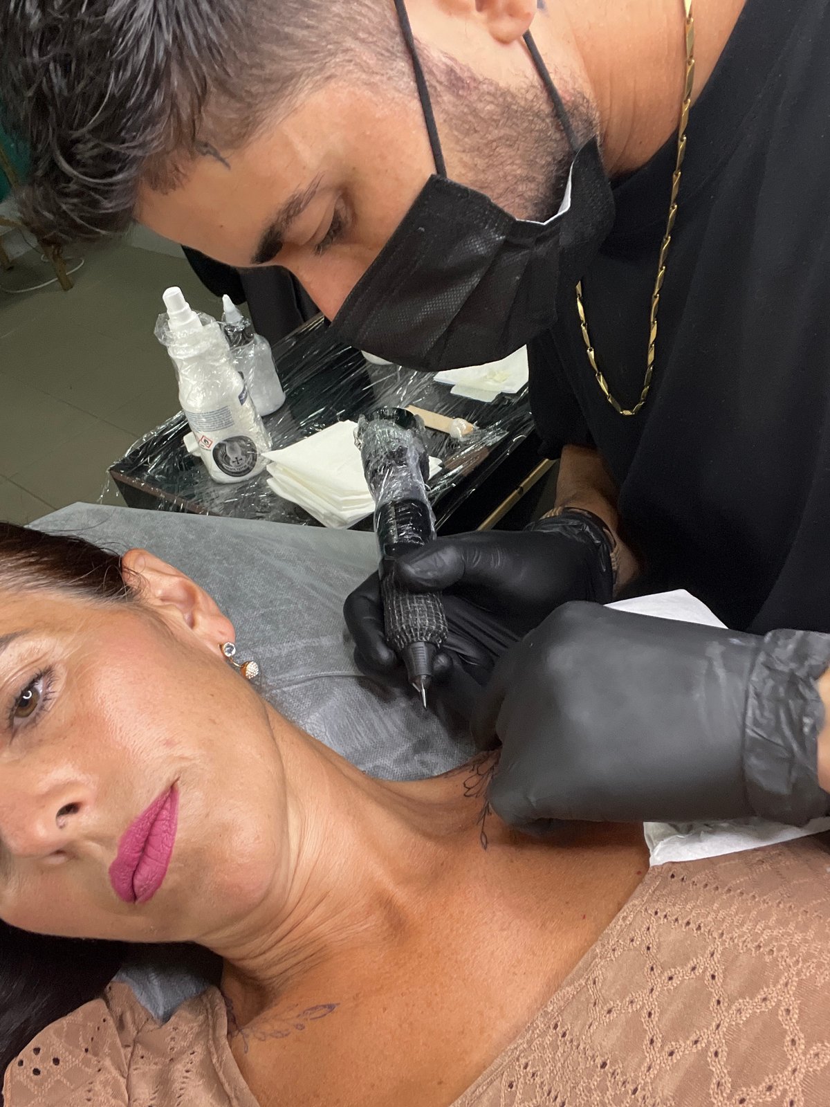 Neck tattoo in progress at a Caldas da Rainha studio