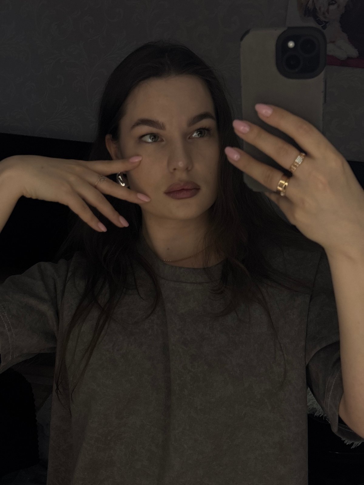 Woman takes selfies with pet dog in Chaikovsky bedroom