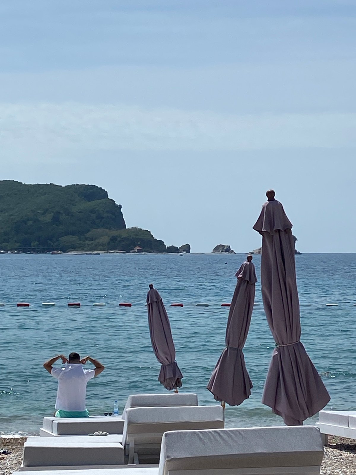 Morning beach preparations documented along Budva's Adriatic shoreline