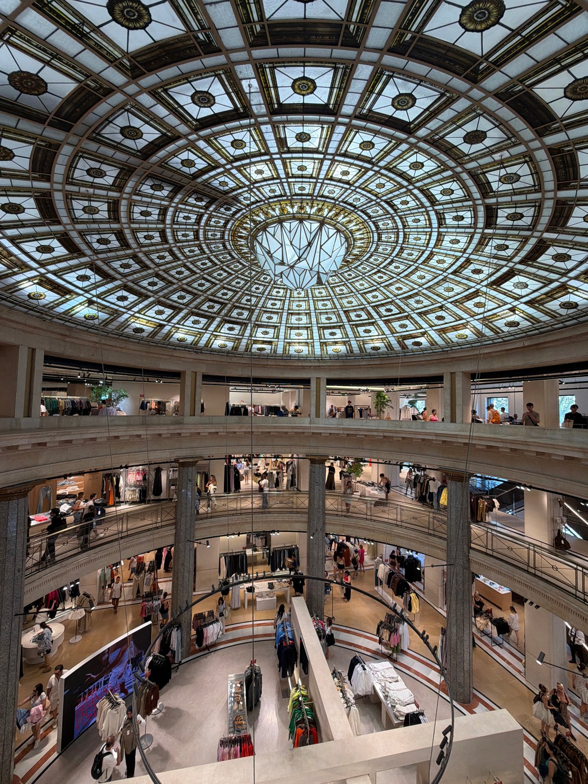 Inside a Barcelona department store with a stunning stained-glass dome