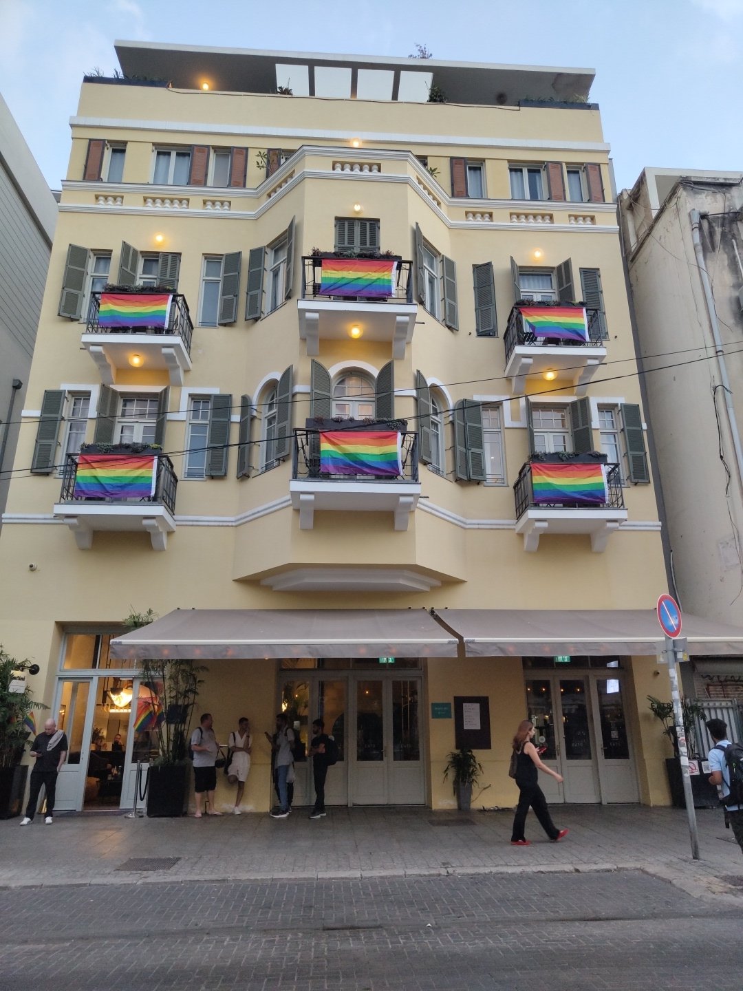 Tel Aviv street life captured: rainbow flags, construction, electric scooter