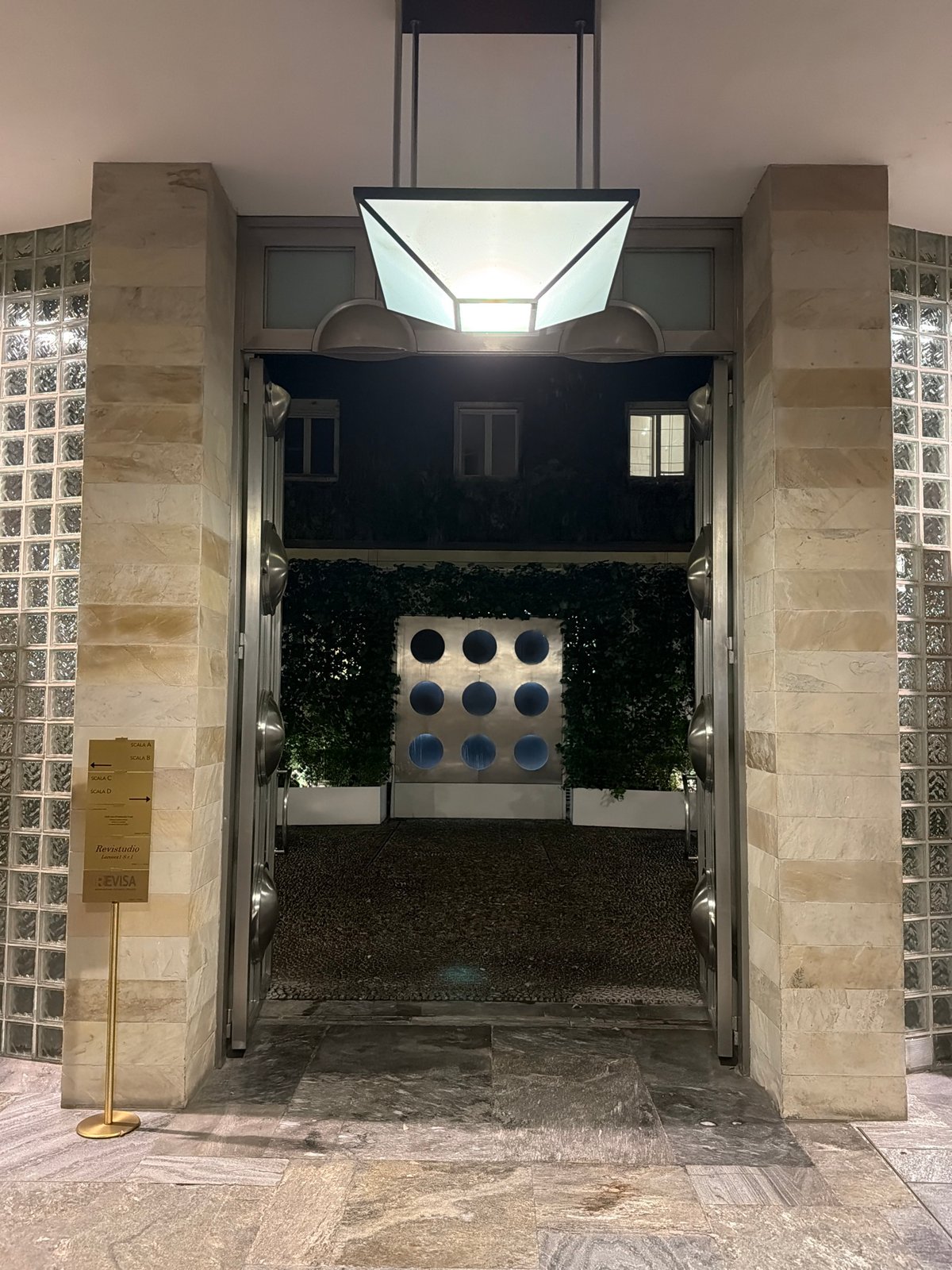 Evening courtyard scene captured in Milan, Italy