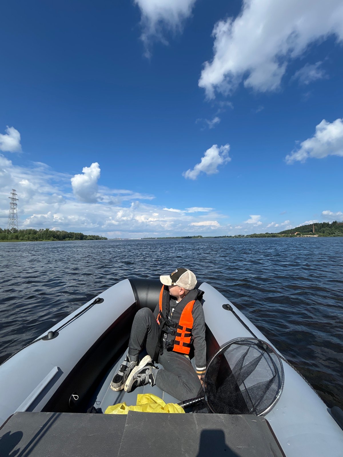 River fishing near Chaykovsky with big sky and forest backdrop