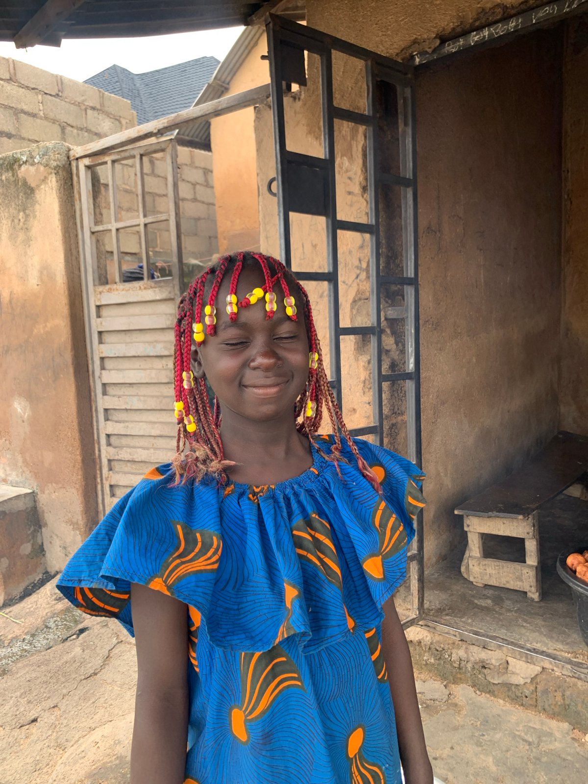 Colorful beads and patterned clothing in urban Jos