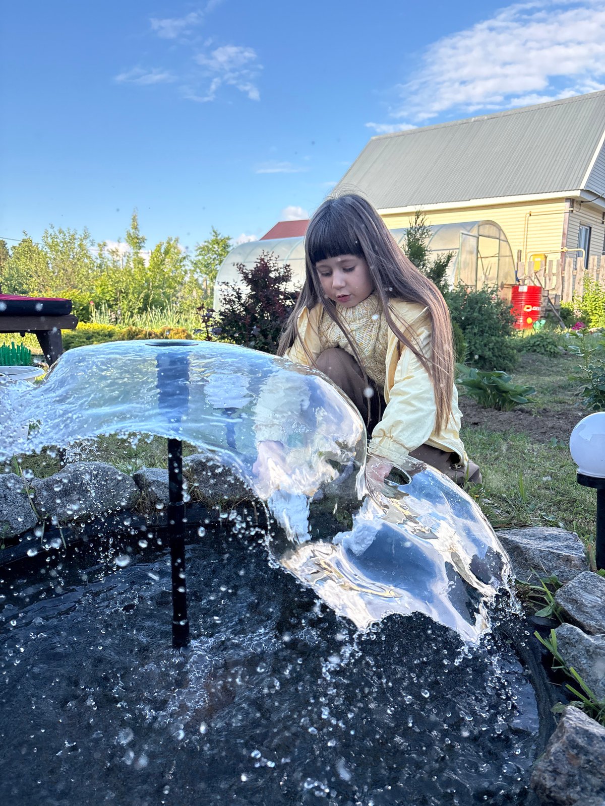Young person enjoys garden day in Chaikovsky, Russia