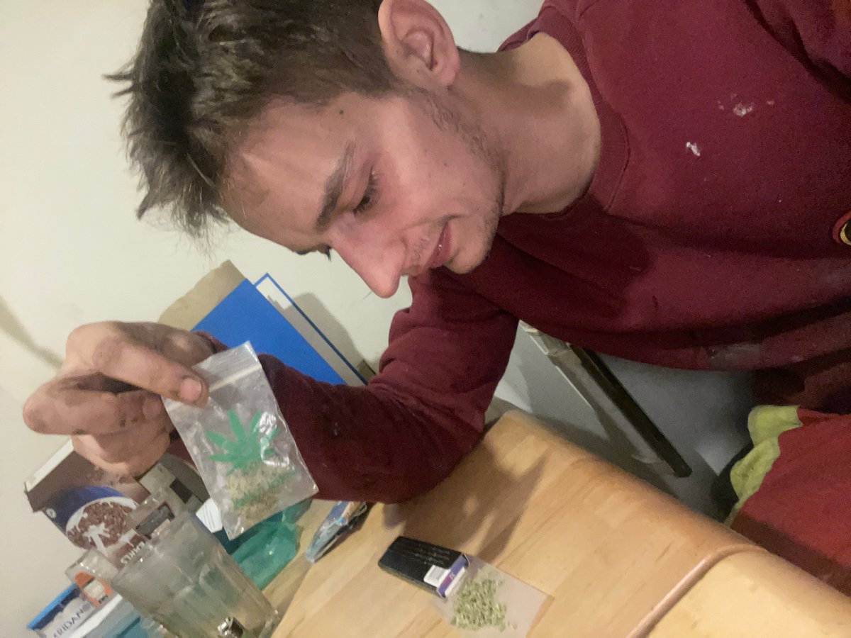 Indoor marijuana rolling session caught from multiple angles.